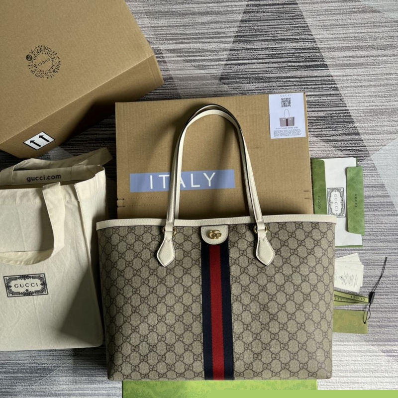 G*u*i shopping bags